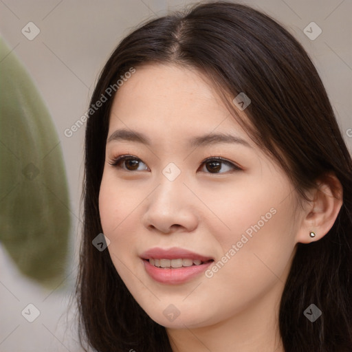 Joyful asian young-adult female with long  brown hair and brown eyes