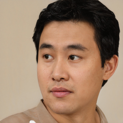 Neutral asian young-adult male with short  black hair and brown eyes