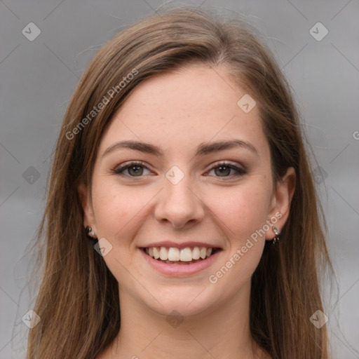 Joyful white young-adult female with long  brown hair and grey eyes