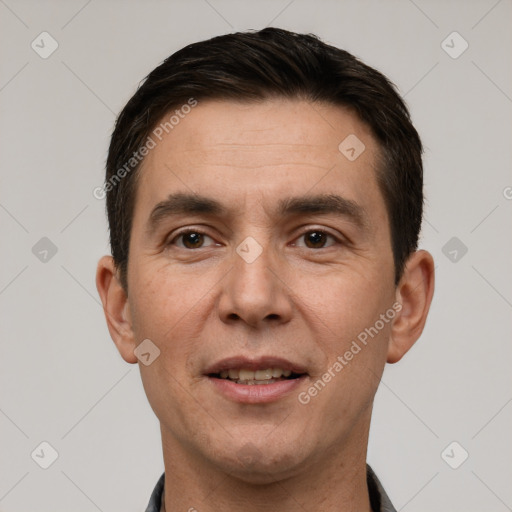 Joyful white adult male with short  brown hair and brown eyes