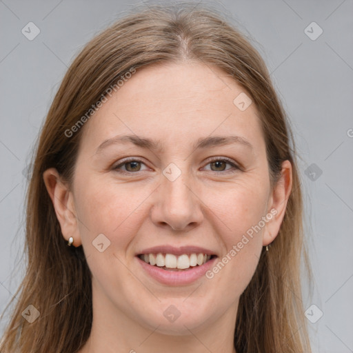 Joyful white young-adult female with long  brown hair and grey eyes