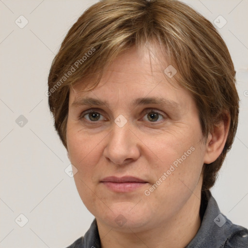 Joyful white adult female with medium  brown hair and grey eyes