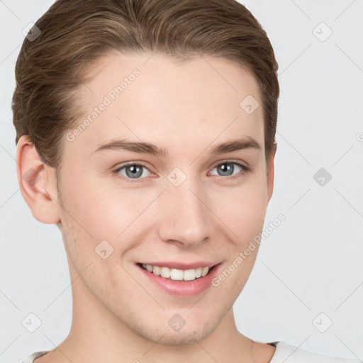 Joyful white young-adult female with short  brown hair and grey eyes