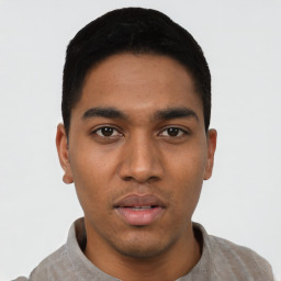 Neutral latino young-adult male with short  black hair and brown eyes
