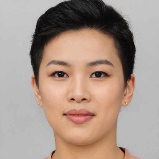 Joyful asian young-adult female with short  black hair and brown eyes