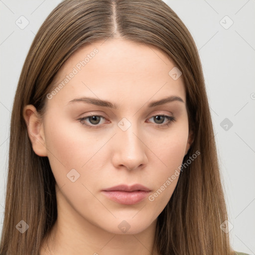 Neutral white young-adult female with long  brown hair and brown eyes