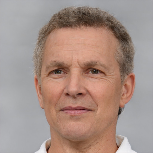 Joyful white middle-aged male with short  brown hair and brown eyes