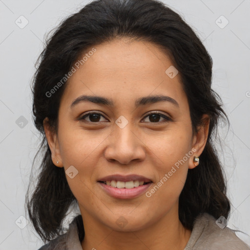 Joyful latino young-adult female with medium  brown hair and brown eyes