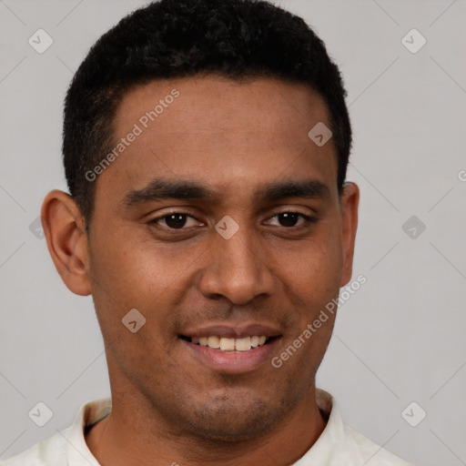 Joyful white young-adult male with short  black hair and brown eyes