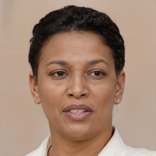 Joyful latino adult female with short  brown hair and brown eyes