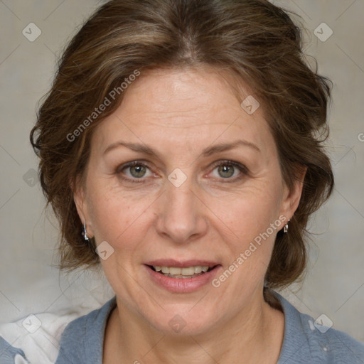 Joyful white adult female with medium  brown hair and blue eyes