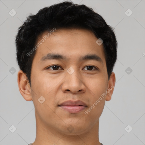 Joyful latino young-adult male with short  brown hair and brown eyes