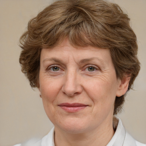 Joyful white middle-aged female with medium  brown hair and brown eyes