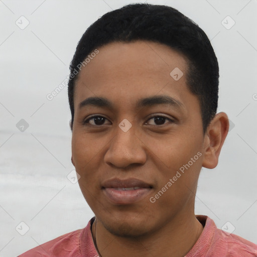 Joyful latino young-adult male with short  black hair and brown eyes