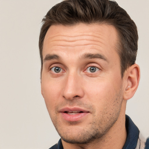 Joyful white young-adult male with short  brown hair and brown eyes