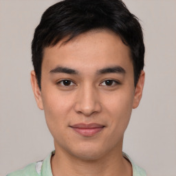 Joyful asian young-adult male with short  black hair and brown eyes