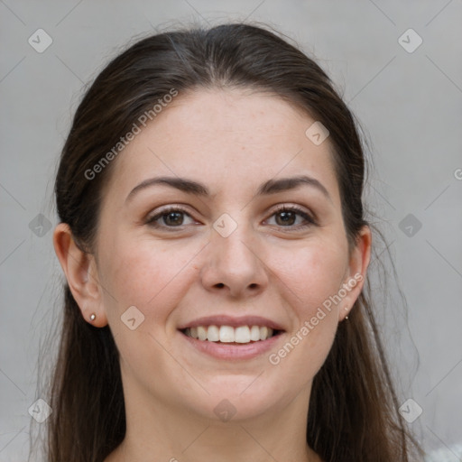 Joyful white young-adult female with long  brown hair and grey eyes