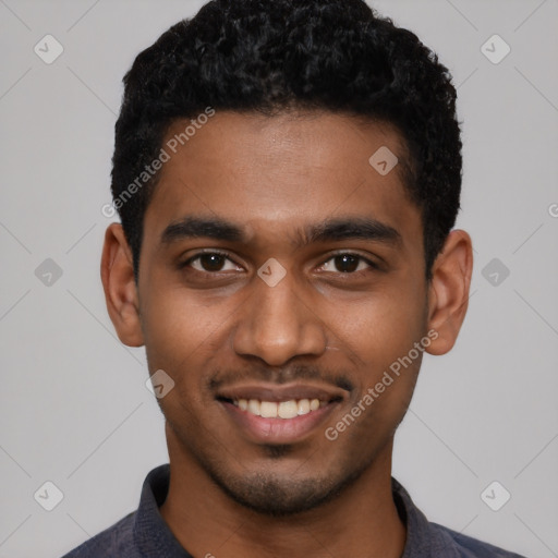 Joyful black young-adult male with short  black hair and brown eyes