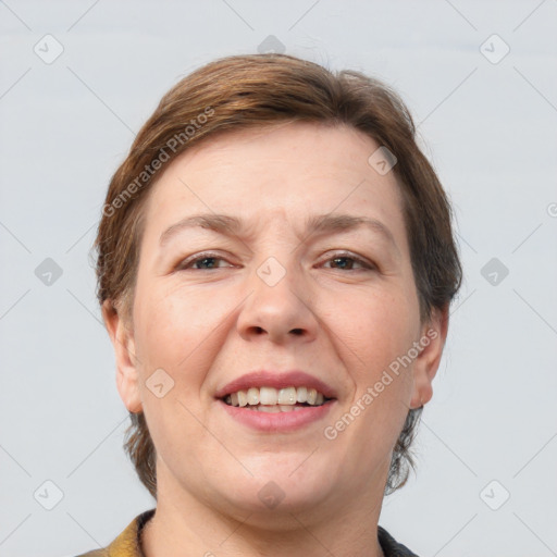 Joyful white adult female with short  brown hair and grey eyes