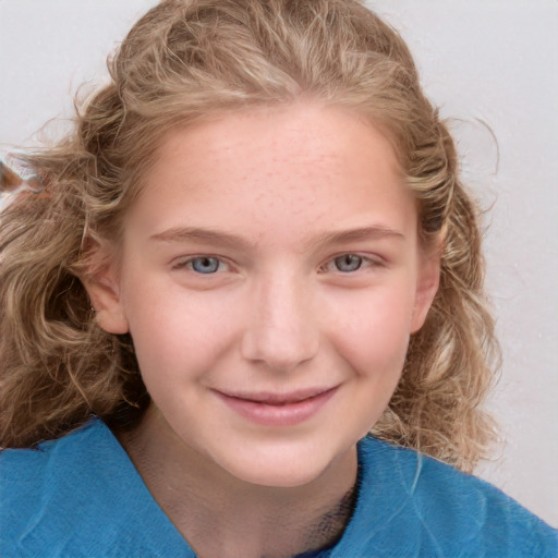 Joyful white child female with medium  brown hair and blue eyes