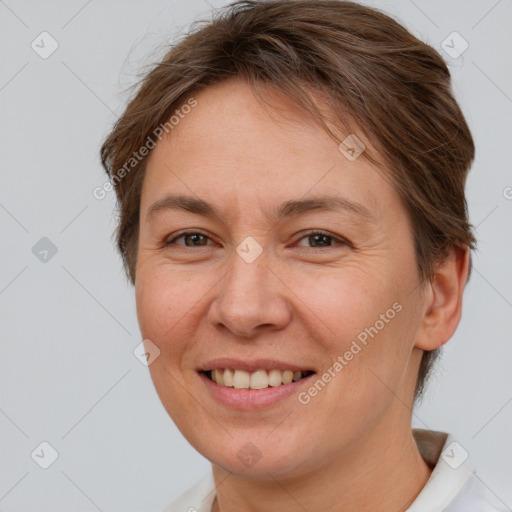 Joyful white adult female with short  brown hair and brown eyes