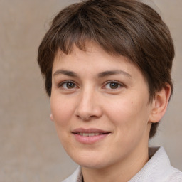 Joyful white young-adult female with medium  brown hair and brown eyes
