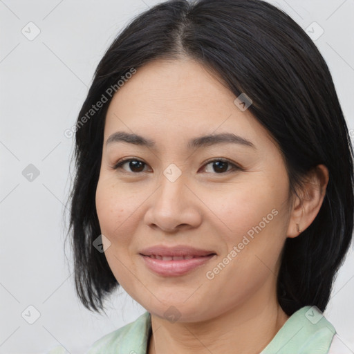 Joyful asian young-adult female with medium  brown hair and brown eyes