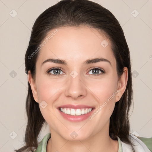 Joyful white young-adult female with medium  brown hair and brown eyes