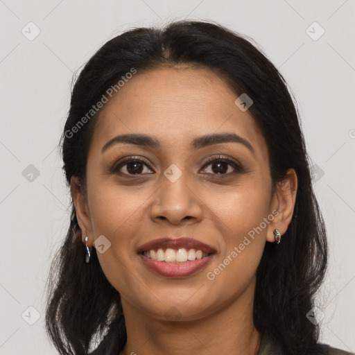 Joyful latino young-adult female with long  black hair and brown eyes