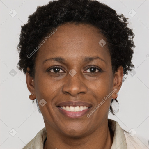 Joyful black adult female with short  brown hair and brown eyes