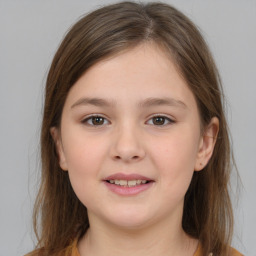 Joyful white child female with medium  brown hair and brown eyes