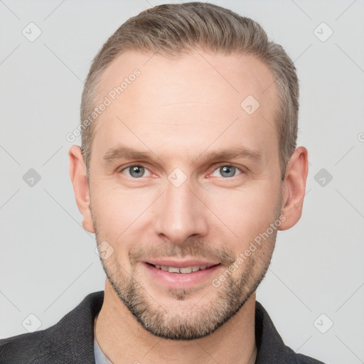 Joyful white adult male with short  brown hair and grey eyes