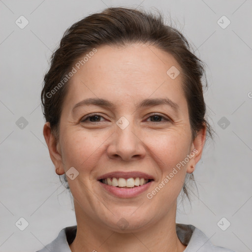 Joyful white adult female with short  brown hair and brown eyes