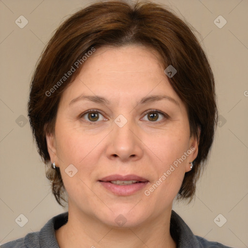 Joyful white adult female with medium  brown hair and brown eyes