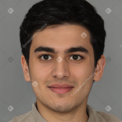 Joyful latino young-adult male with short  brown hair and brown eyes