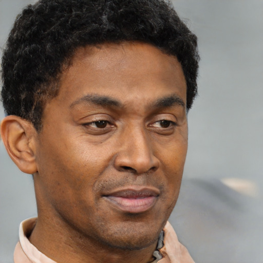 Neutral black young-adult male with short  brown hair and brown eyes