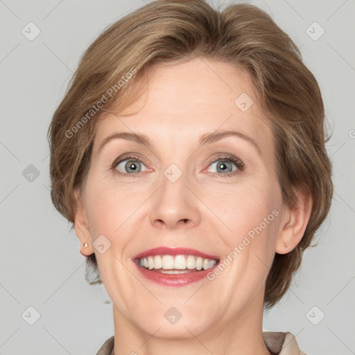 Joyful white adult female with medium  brown hair and grey eyes