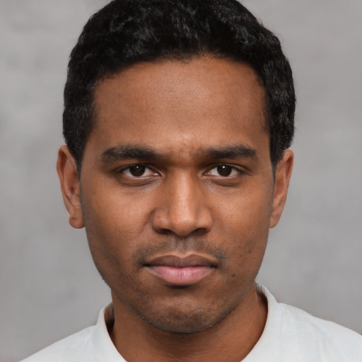 Neutral latino young-adult male with short  black hair and brown eyes