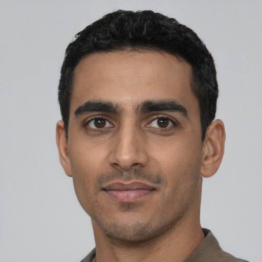 Neutral latino young-adult male with short  black hair and brown eyes