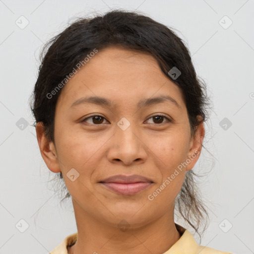 Joyful latino adult female with short  brown hair and brown eyes