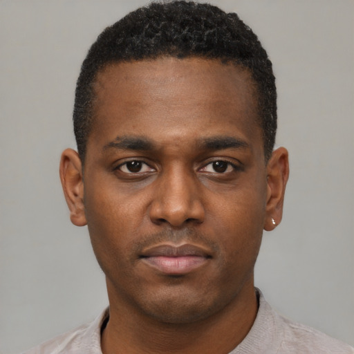 Neutral latino young-adult male with short  brown hair and brown eyes