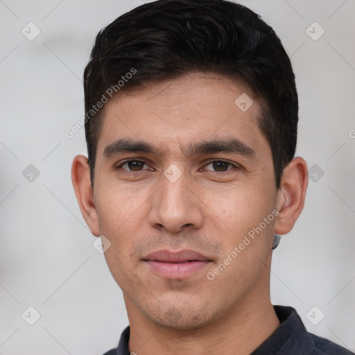 Joyful white young-adult male with short  black hair and brown eyes