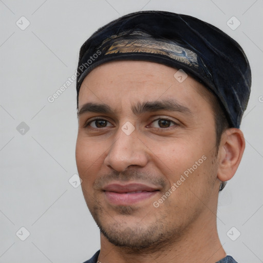 Joyful white young-adult male with short  black hair and brown eyes