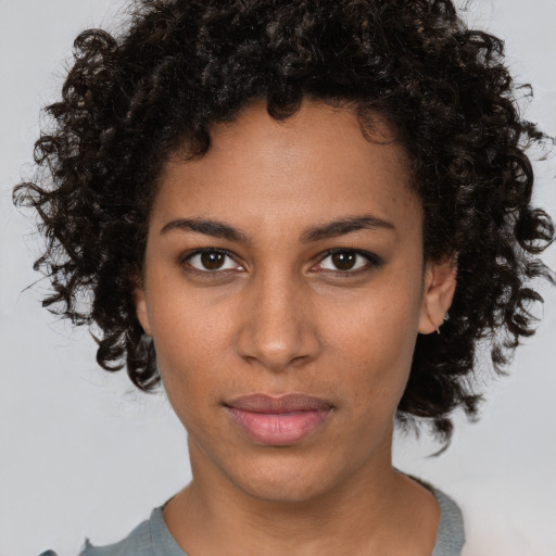 Neutral black young-adult female with short  brown hair and brown eyes