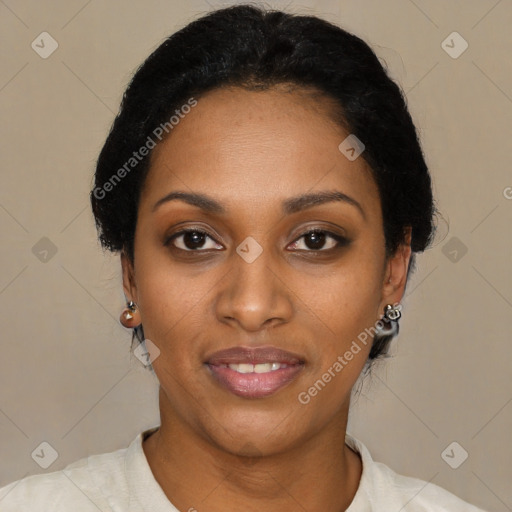 Joyful black young-adult female with short  black hair and brown eyes