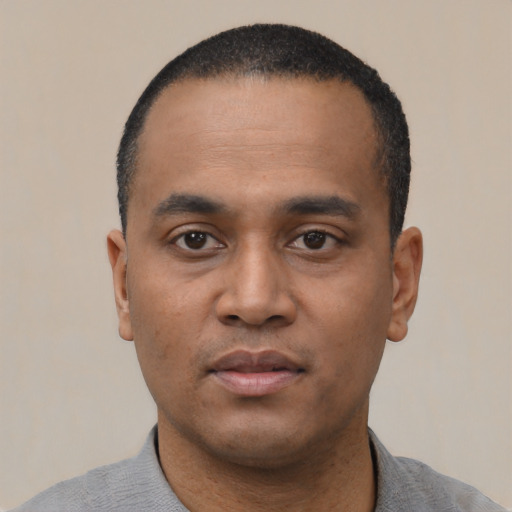 Neutral black young-adult male with short  black hair and brown eyes