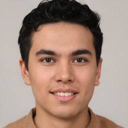 Joyful latino young-adult male with short  brown hair and brown eyes