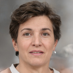 Joyful white adult female with short  brown hair and brown eyes