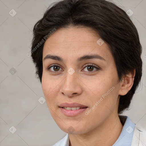 Joyful white adult female with medium  brown hair and brown eyes