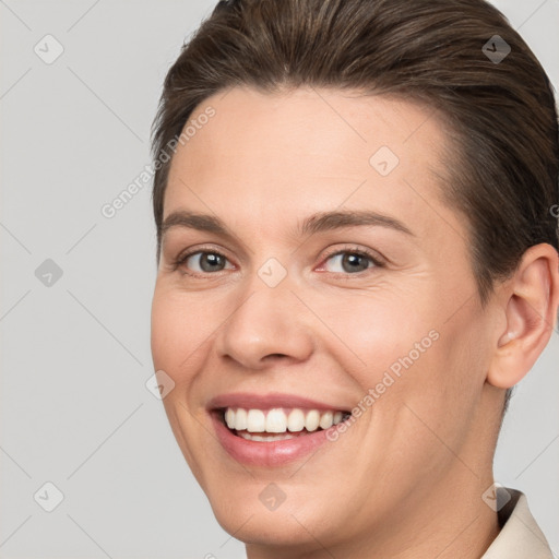 Joyful white young-adult female with short  brown hair and brown eyes